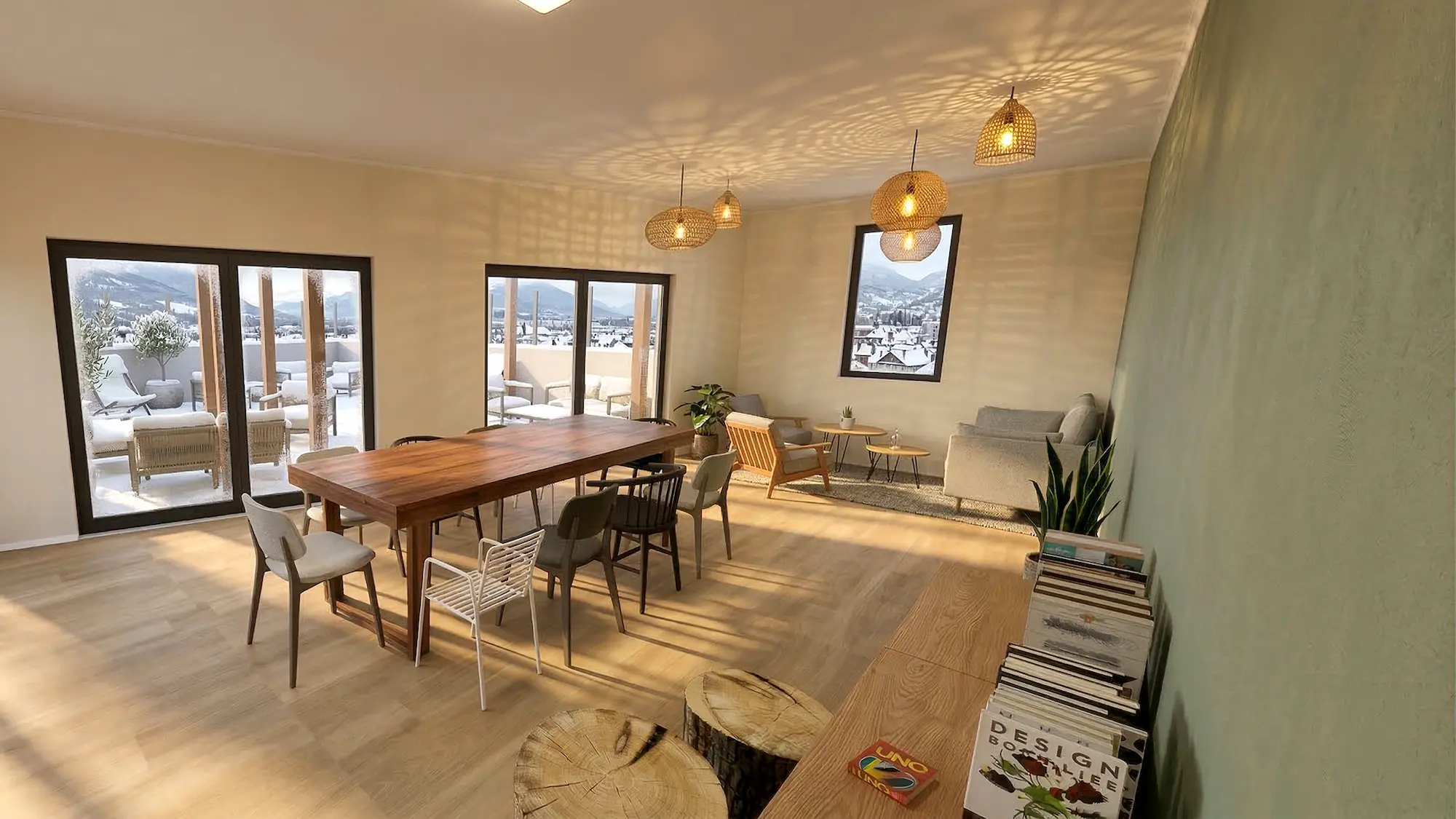 Salle de pause commune dans une résidence à Chambéry avec espace repas, table conviviale et coin détente confortable