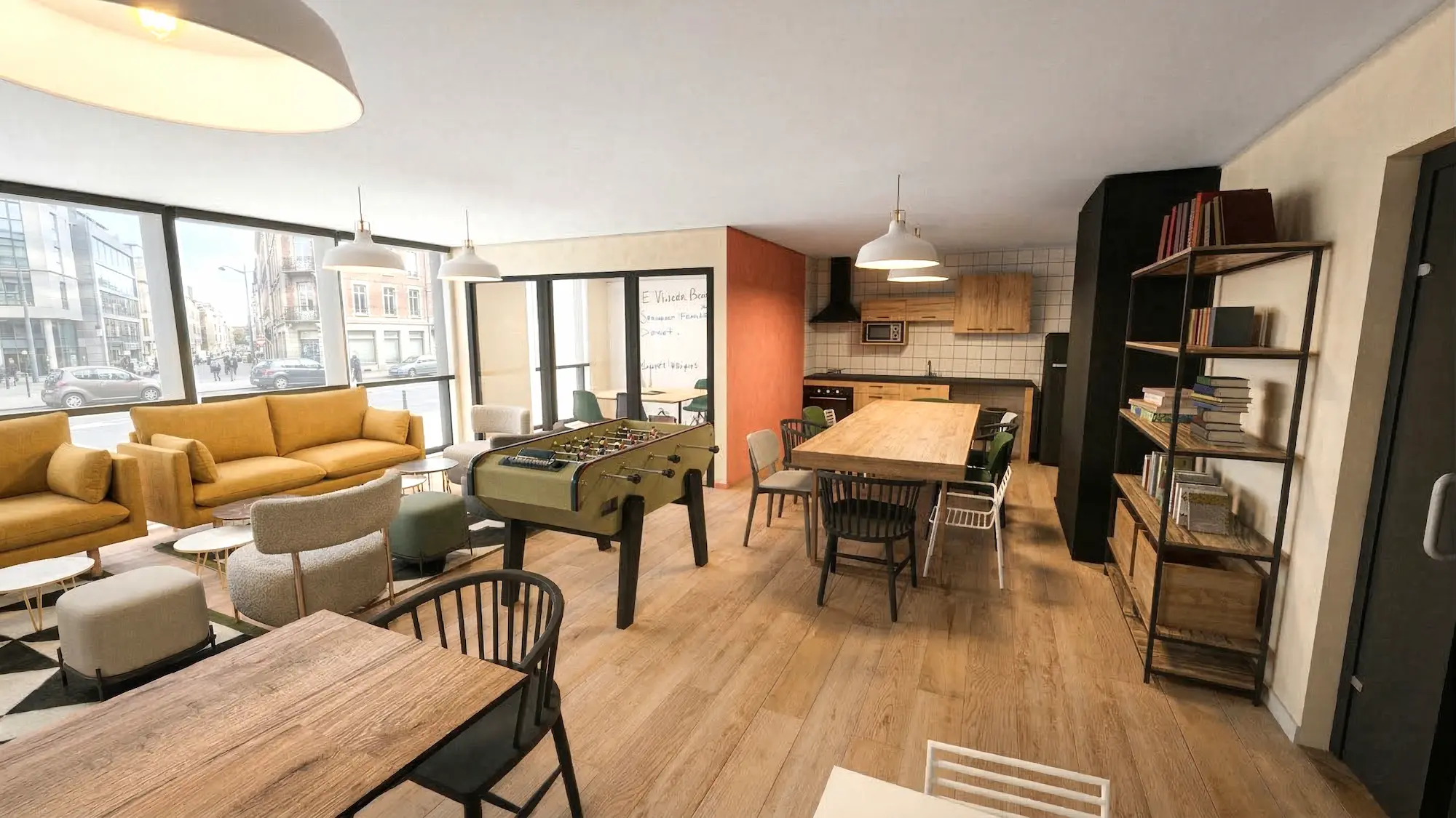 Espace cuisine partagé lumineux et moderne dans une résidence de coliving à Bezons, avec équipements complets, table conviviale et ambiance chaleureuse